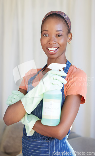 Image of Black woman, spring cleaning service and spray bottle for housekeeping, sanitation and disinfection of dirt, bacteria and dust in home. Portrait happy maid, hospitality cleaner and house maintenance