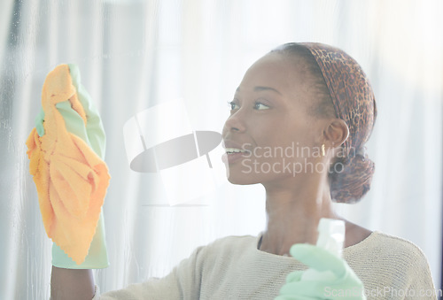 Image of Cleaning, window and black woman with spray and cloth for dust, bacteria and housekeeping service. Disinfection, hygiene and cleaner with girl and glass surface at home for washing, germs or sanitize