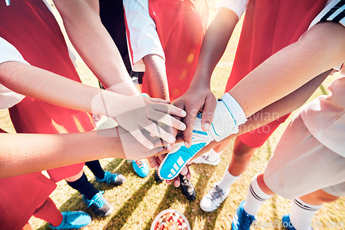 Image of Hands, team and soccer in support, trust and collaboration for diversity in sports on a field in the outdoor. Hand, football and teamwork connect together in motivation, support or plan to win game