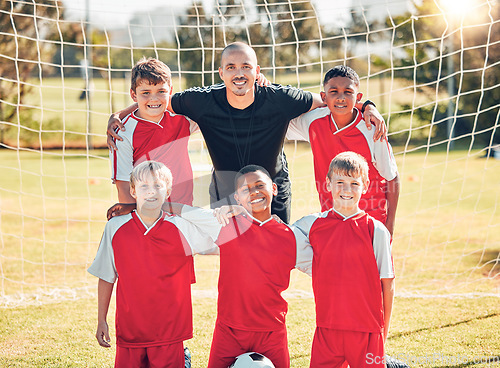 Image of Soccer, children and portrait of a coach with his team on an outdoor field after a match or training. Football, sports and kids group standing with a trainer on a pitch for game, exercise or practice