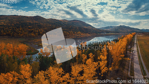 Image of Aerial view of road in beautiful autumn Altai forest