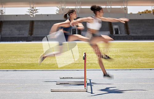 Image of Fitness, race and hurdles with a black woman and sports athlete racing on a track for endurance competition. Motion blur, energy or running with a female and rival or competitor jumping over a hurdle