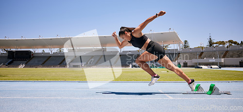 Image of Fitness, start and running with woman in stadium for sports, training and marathon on race track. Fast, action and cardio with runner of competition field for speed, energy and endurance performance