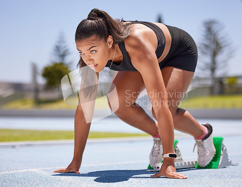 Image of Runner, fitness and woman ready to run race, exercise and running on stadium track for sport and workout. Young athlete, cardio and focus, training for marathon or relay, determined at start.