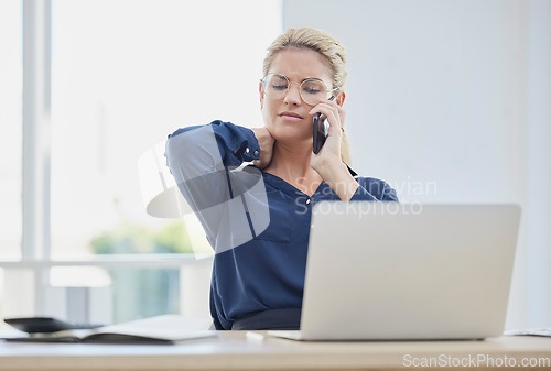 Image of Phone call, stress and neck pain with a business woman at work on a laptop in her office alone. Computer, posture and communication with a female employee working or talking on a mobile at her desk