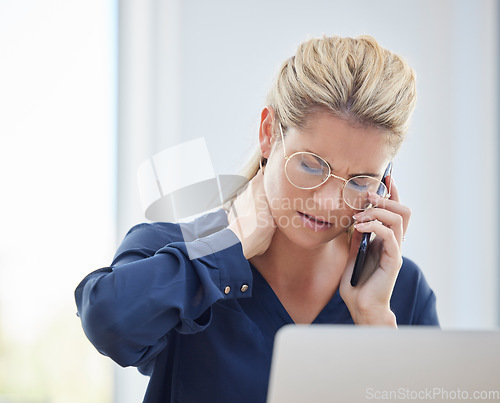 Image of Phone call, neck pain and business woman with stress while working on a project with her laptop. Exhausted, stressed and professional employee on a mobile conversation with a smartphone in the office