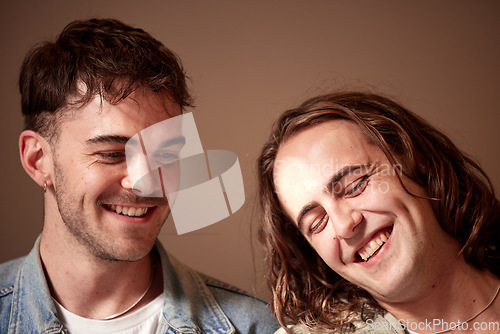 Image of Love, happy and gay with a normal couple in studio on a brown background for lgbt inclusion or romance. Smile, relationship and homosexual with a young man and his partner bonding together inside