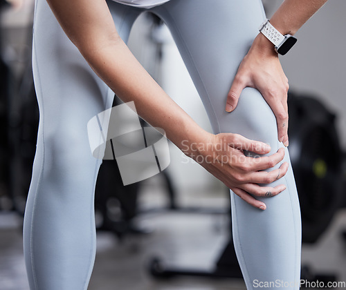 Image of Hand, leg pain and woman at the gym in fitness fail, muscle training mistake or joint discomfort. Sports woman, knee pain and girl suffering from arthritis, inflammation or bruise during workout