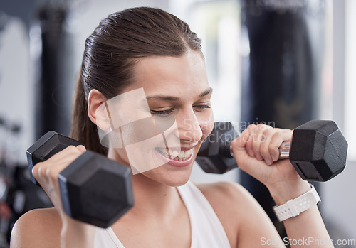 Image of Fitness, weightlifting and smile with woman in gym for training, workout and health. Sports, exercise, and wellness with girl athlete and dumbbells for endurance, strength and bodybuilder energy