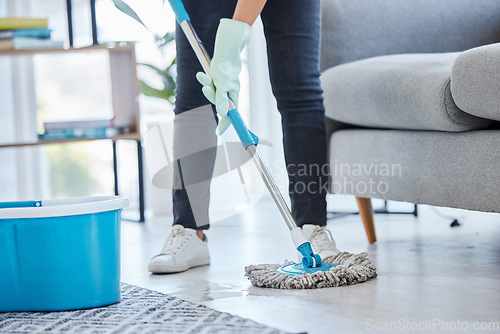Image of Mop, flooring and woman cleaning living room house, home and apartment. Cleaner, maid and housekeeping service on wet ground, care and safety of virus, bacteria and dust for household disinfection