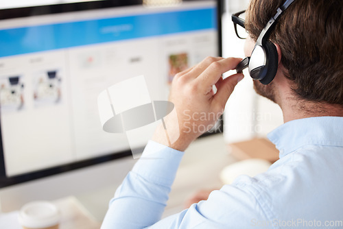 Image of Man, call center and headset for phone call, talking with clients and telemarketing in office at desk. Young male, agent or working with digital device, computer and for customer service and support