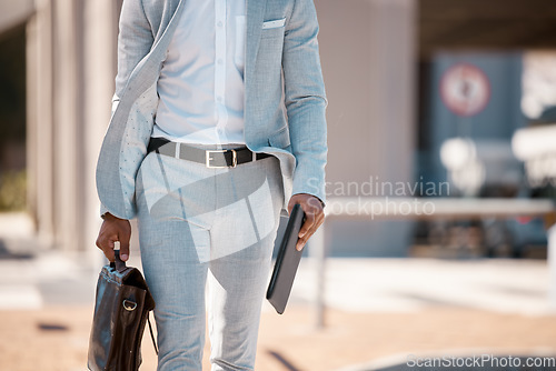 Image of Businessman, walking to work and with briefcase in city with tablet in hands traveling, outdoor stroll and work in town. Professional employee, walk cityscape street and man in gray suit in sunshine