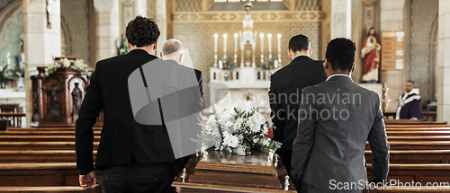 Image of Funeral, church and group carry coffin in service, death or sermon for burial with support. Friends, family or pallbearers with casket for respect, help or sorrow in mourning, worship or god religion