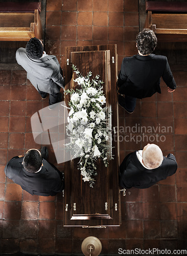 Image of Funeral, family coffin and church above for death, grief or burial service with solidarity. Group, pallbearers and people together with casket for respect, farewell or sad in mourning, mass or loss