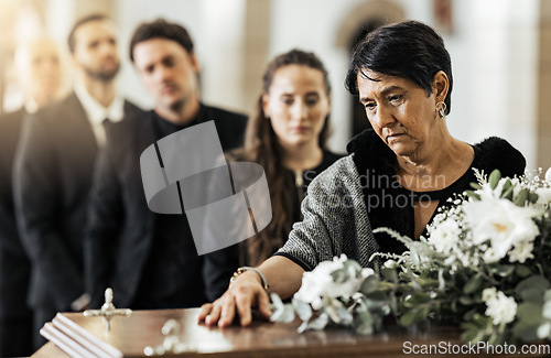 Image of Funeral, death and coffin in church or Christian family gathering together for support. Religion, sad people and mourning loss or religious catholic men and women grief in church service over casket