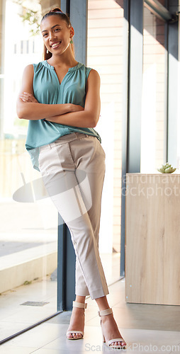 Image of Leadership, business woman and crossed arms for startup company, marketing success and confident in office. Leader, female entrepreneur and lady with smile, pride for corporate position and career.