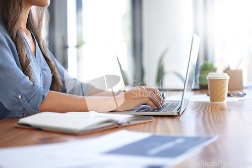 Image of Woman at work, typing on laptop and writing business report for financial audit in accounting firm, finance department or advertising company. Email communication, office worker and company employee