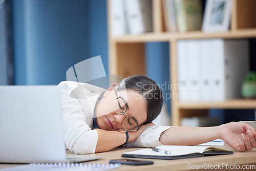 Image of Burnout, sleeping and tired business woman in office after working overtime or overwork. Rest, relax and exhausted sleepy female employee taking nap by table after all night work on project deadline