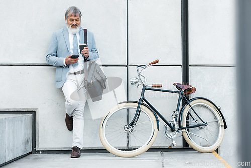 Image of Businessman, phone and coffee with bicycle in city on social media, web or internet browsing. Tech, bike or senior manager drinking tea while on 5g smartphone app, networking or text message on break