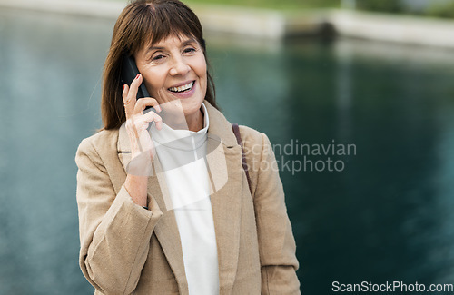 Image of Happy, senior woman and phone call for conversation, discussion and with smile outdoor. Retirement, mature female and confident lady with smartphone for talking, communication and speaking to connect