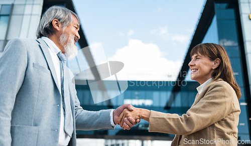 Image of Partnership, meeting and handshake with business people in city for global merger, collaboration or deal. Thank you, welcome or contract with ceo shaking hands with client for b2b, crm and leadership