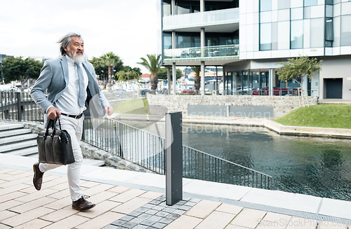 Image of Businessman, running and work time in the city for urgent meeting, deadline or behind schedule. Elderly man having a run to the office for business deal, appointment or opportunity in the outdoors