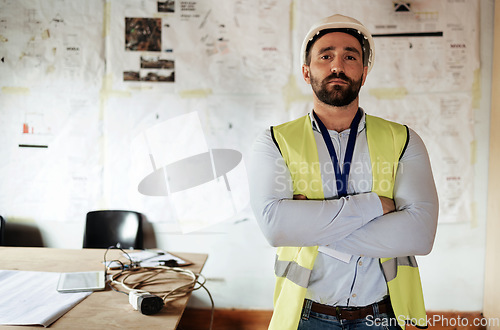 Image of Construction worker, portrait and man with arms crossed in office or building site for architecture project. Architect, engineer or serious male contractor, leader or engineering manager at workplace