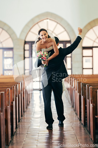 Image of Celebration, carrying and man with bride after wedding in a church, happy and smile for marriage event. Love, comic and couple walking in a building after getting married to celebrate together