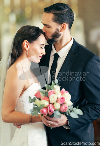 Image of Wedding, couple and forehead kiss with love while holding a bouquet of flowers for marriage, walking down the isle and marry. Bride, groom and newlywed people happy together after a celebration event