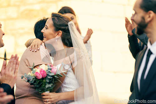 Image of Wedding, marriage and bride hug family guests with a smile while leave church with groom after marrying, celebration and event to celebrate love. Romance, commitment and happy married couple together