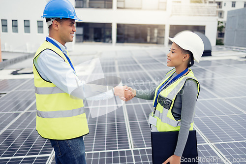 Image of Solar energy, solar panel worker and renewable energy handshake electricity deal of sustainability, power plant development and innovation. Clean energy, sustainable technology and green construction