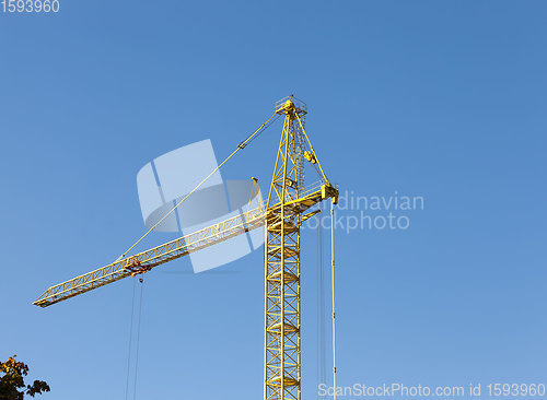 Image of construction cranes with construction equipment