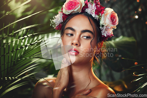 Image of Flowers, nature and beauty of a model in a forest with natural skincare, makeup and skin wellness. Woman with a flower crown in a forest or jungle with organic skin care and natural cosmetics