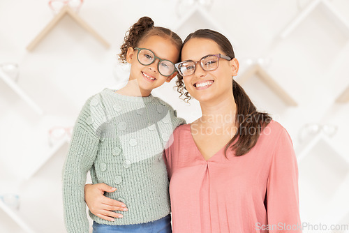 Image of Portrait, mother and girl with glasses for vision, hug and smile being happy for eye care, loving and eye exam together. Eyewear, mama and daughter embrace, eyesight and healthcare for strong eyes.