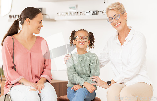 Image of Children, glasses and optometry with a mother and daughter at the optician for an eye test. Vision, family and retail with a woman and girl customer shopping for prescription lenses at an optometrist