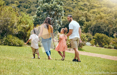 Image of Family, kids and walking in the park for bonding, fun and care in summer outside. Mother, father and parents playfully walk with children, son and daughter siblings in a garden for bond