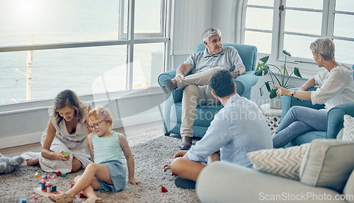 Image of Family, generations and love together in living room with parents, grandparents and child play with toys and bonding. Big family, men with women and kid at home, spending quality time and care.