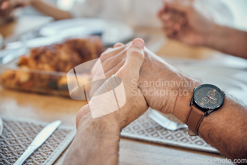 Image of Holding hands, praying thanks for food and prayer for lunch, dinner table and worship, gratitude and respect in family home. Closeup christian spiritual people, eating together and pray faith in god