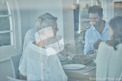 Image of Happy family, food or thanksgiving turkey on table in house, home and restaurant for party, event or meat lunch. Smile, people or men or women and festive meal, celebration or nutrition health dinner