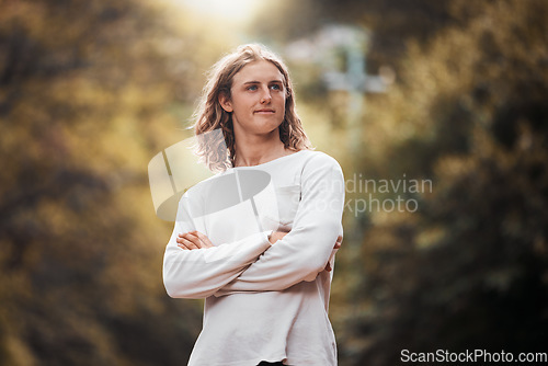 Image of Man, arms crossed or thinking of nature environment sustainability, climate change goal or environmental target in forest woods. Happy, satisfied or planet earth volunteer and recycle innovation idea