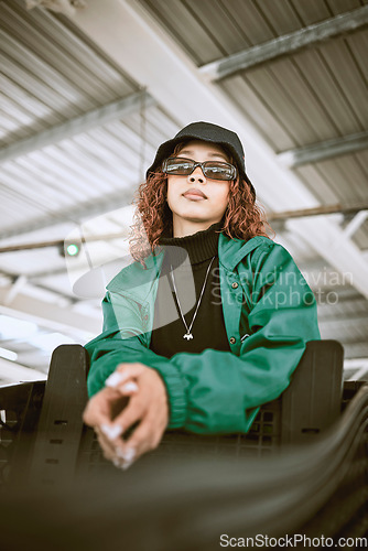 Image of Youth, fashion and black woman in sunglasses city outdoor shopping mall or urban bridge and portrait for designer green. Teenager girl in streetwear clothes and glasses for hip hop brand lifestyle