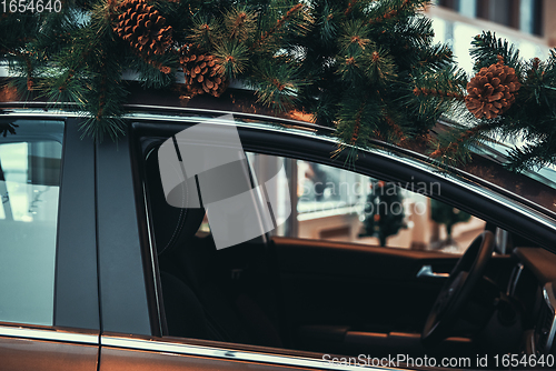 Image of Car with christmas tree on roof