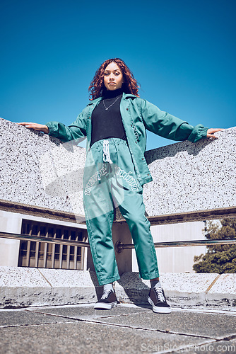 Image of Green, designer and fashion black woman in urban city portrait pm blue sky mock up for marketing, advertising or youth promotion. Young gen z girl streetwear design clothes with mockup rooftop space