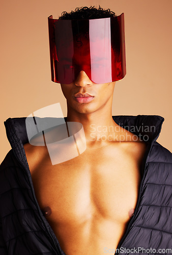 Image of Beauty, futuristic fashion and man in sunglasses with creative cyberpunk style, modern accessory and trend setting sci fi eyewear. Black man, artistic red glass visor and future of edgy new clothing