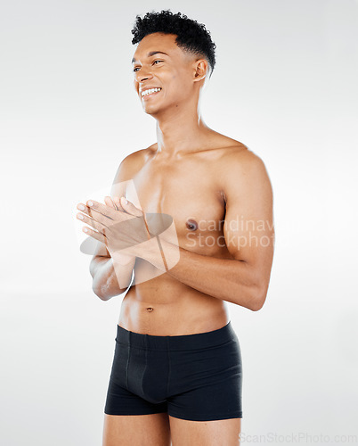 Image of Fitness, health and wellness with man in a studio for exercise, body care and workout advertising on white background. Healthy, training and black man model proud, smile and happy with body goals