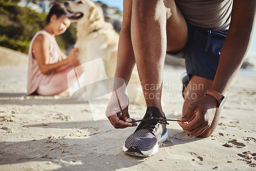 Image of Fitness, shoes and lace on beach sand for running exercise, training or workout in the outdoors. Active runner tying shoe laces for a sports run, walk or healthy cardio on the sandy ocean coast