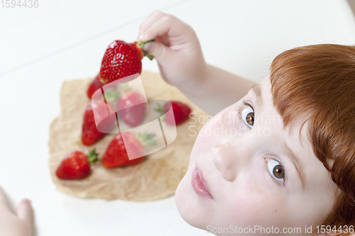 Image of boy and strawberries