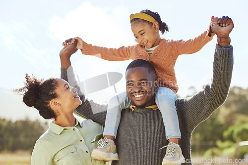 Image of Lifting, smile and fun happy family play, bond or enjoy outdoor quality time together. Love, summer freedom or excited black father, mother or parents with kid girl with happiness on holiday vacation