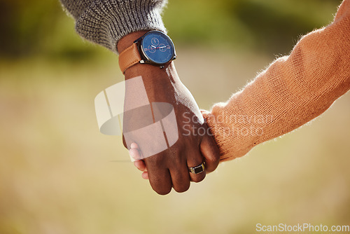 Image of Parent, child and holding hands for care, love and support in trust, relationship and walk together in the park. Hand of father or mother with kid walking for family time and safety in the outdoors