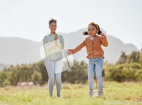 Image of Mother, girl and child jumping, playing and clapping in game in nature park, garden environment or sustainability field. Smile, happy or cheering mom and kid in energy, freedom or fun summer activity